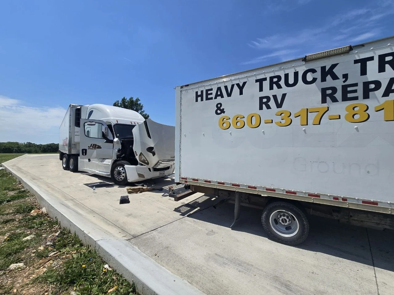 A&A Heavy Duty Repair & Towing service truck arrives at a broken-down semi on the roadside