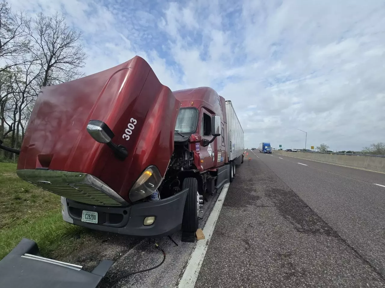 Semi truck stopped on the interstate shoulder after an air brake failure