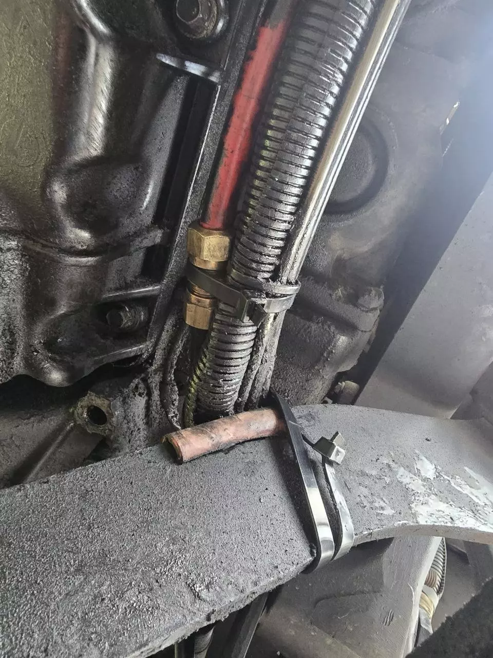 Close-up of a semi truck's air brake line during roadside diagnosis