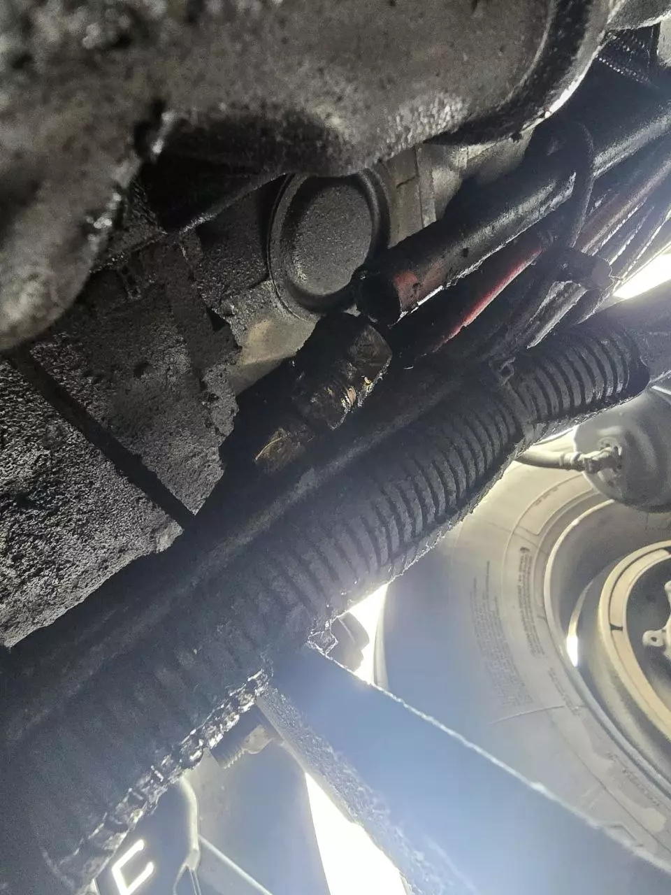 Repaired air brake hose secured back in place under the truck