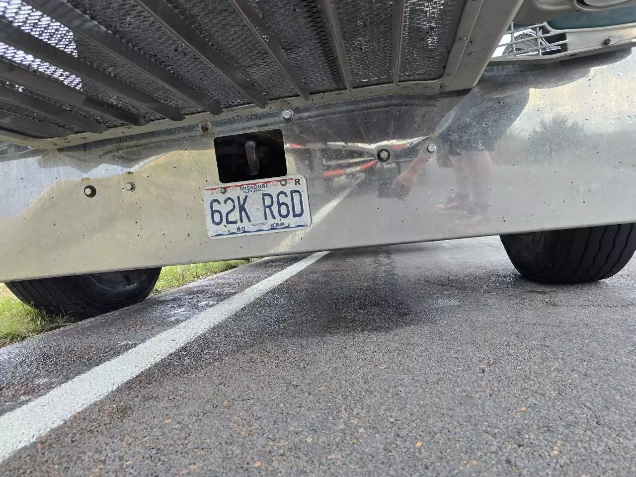 Livestock trailer hauling hogs stopped roadside during the repair