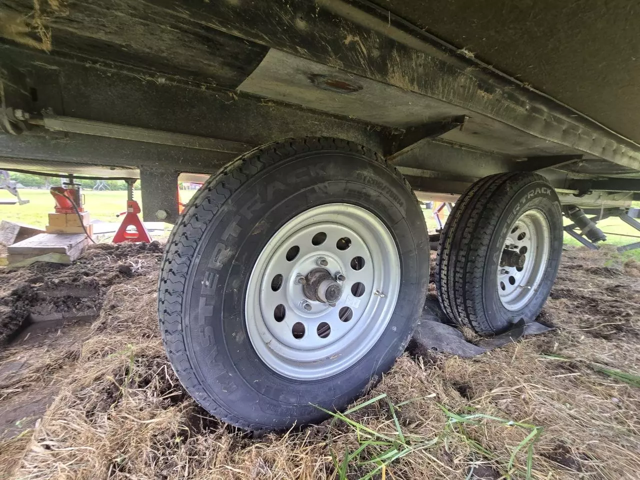 Close-up of dry-rotted camper trailer tires before replacement
